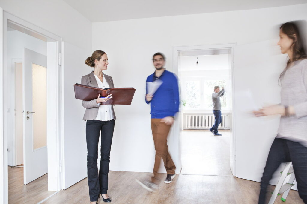 Couple making an agreement with estate agent